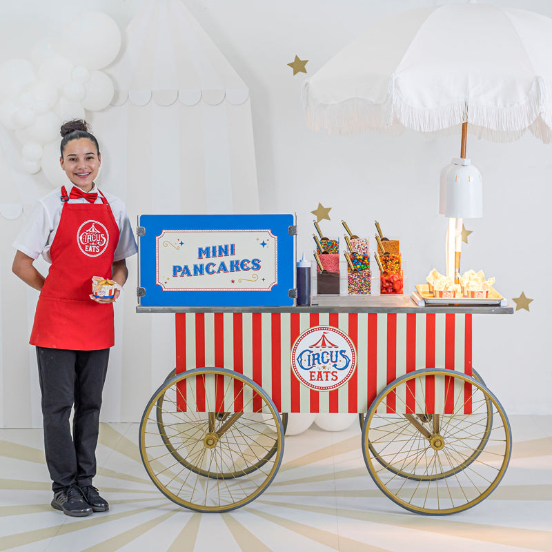 mini pancakes wagon with uniformed attendant