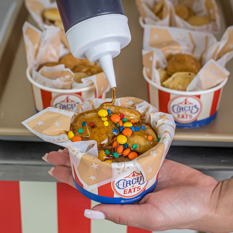 mini pancakes wagon with toppings like syrup M&M's and sprinkles